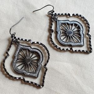 Black metal and glitter quatrefoil dangle earrings